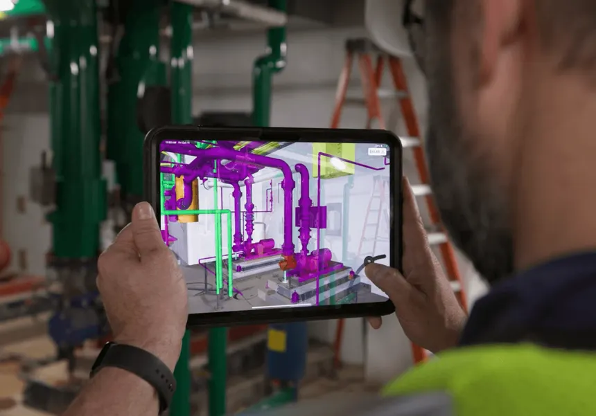 Contractor reviewing coordinated BIM models on a construction project.