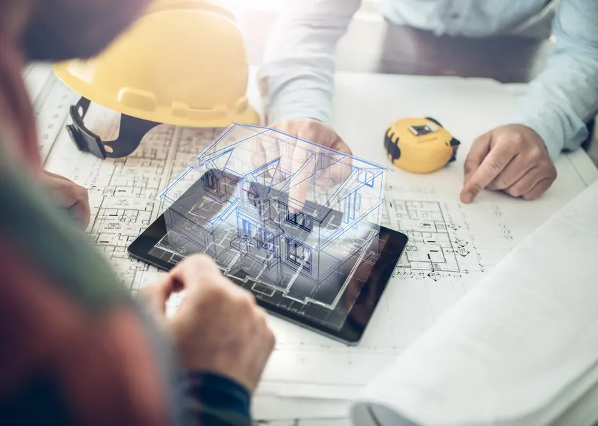 BIM engineers reviewing coordinated models for quality assurance.